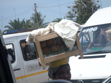 A woman sells fried bread